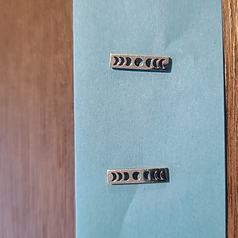 Silver tone moon phases earrings